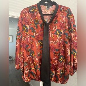 Women’s satin feeling blouse with faux leather tie